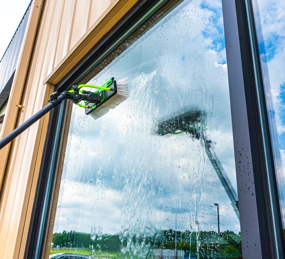 Shine Brothers cleaning a large storefront window